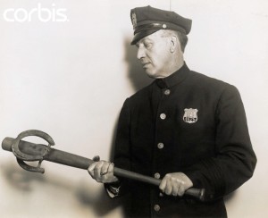 Policeman Holding Murder Weapon